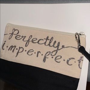 Cute makeup bag / or a small wallet .